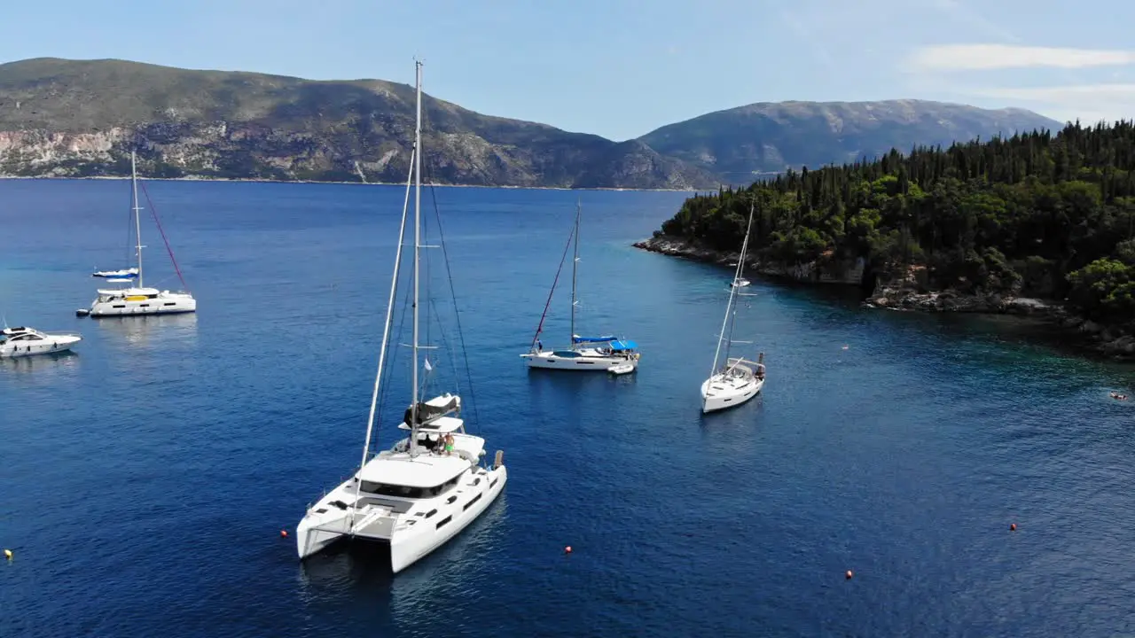 Luxury Boats And Yachts Anchored At The Crystal Blue Waters Of Foki Beach In Kefalonia Greece