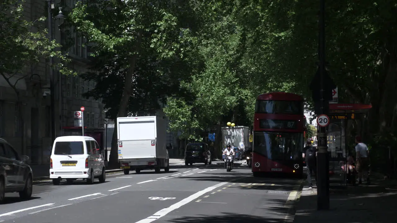 Routemaster Bus Being Hailed On Millbank Road In London