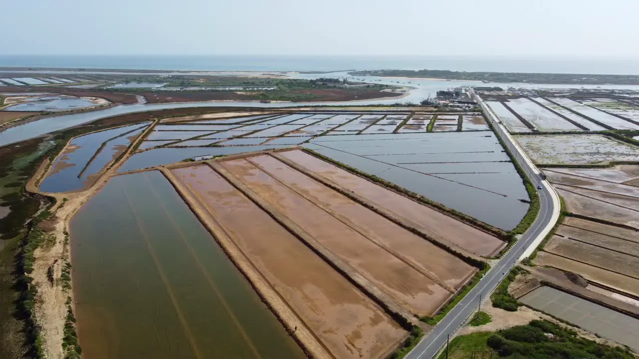 The road to the sea Tavira Portugal salt lagoons and nature reserve with the Atlantic Sea behind