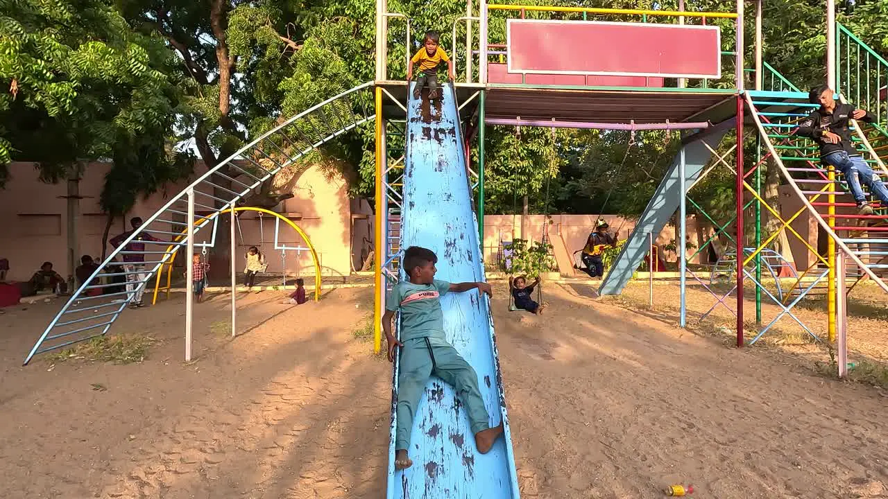 School kids are having fun in public amusement park on holidays