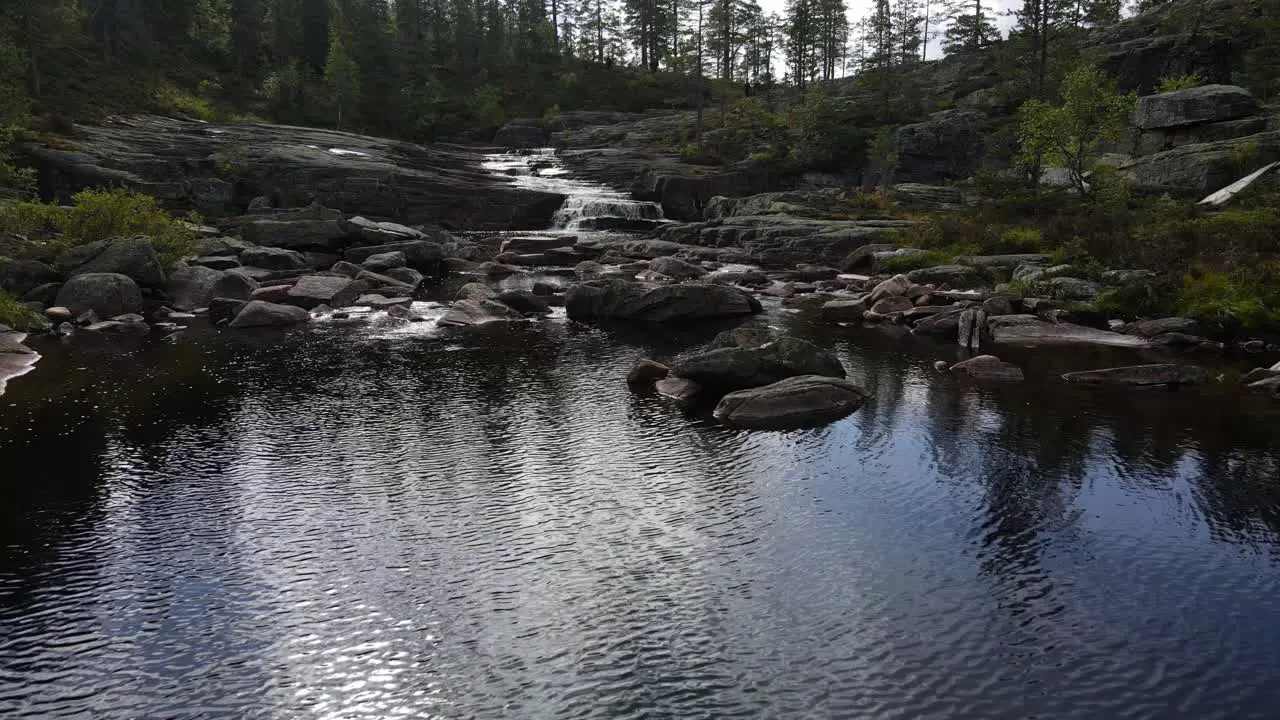 Flying over top of a waterfall