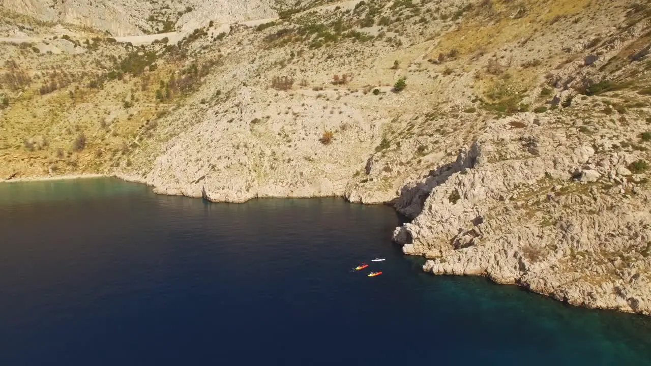 A beautiful view of the company in canoes on the wonderful sea coast