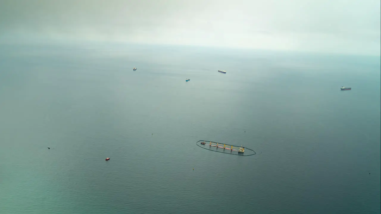 Floating farm and sailing vessel near Gibraltar view from above