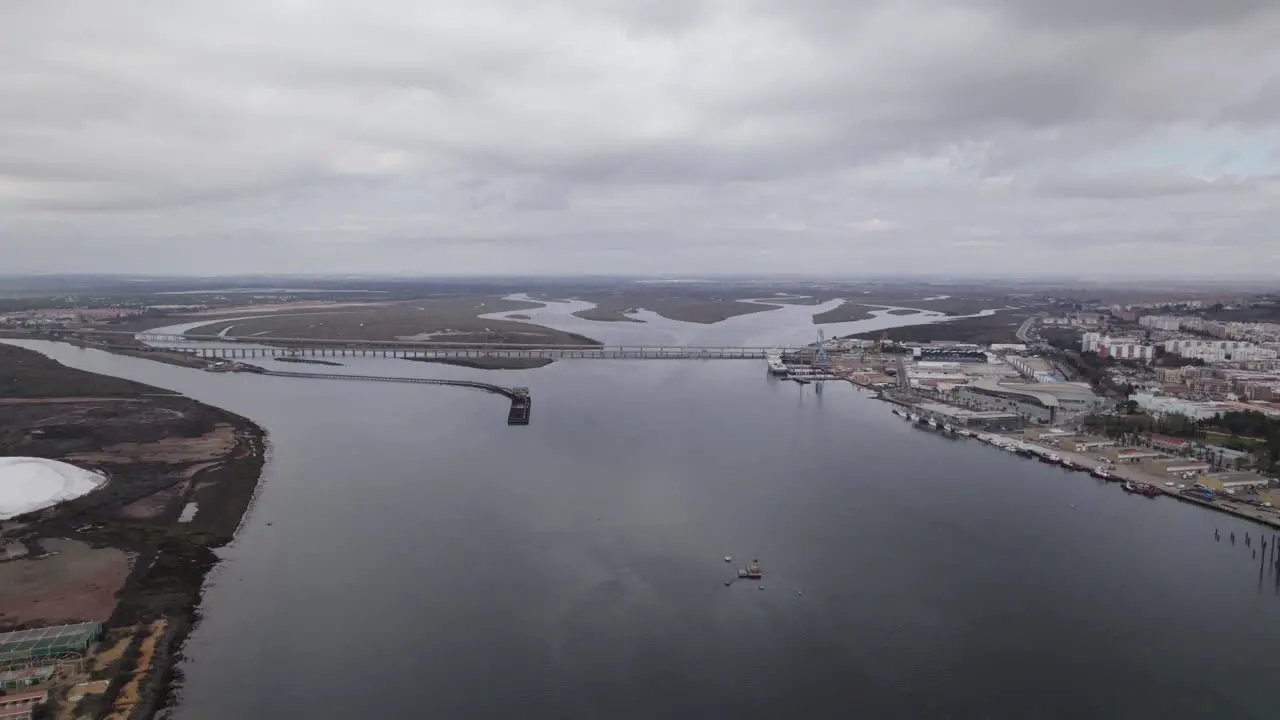 Drone flight toward Santa Eulalia bridge over Odiel River Huelva Spain