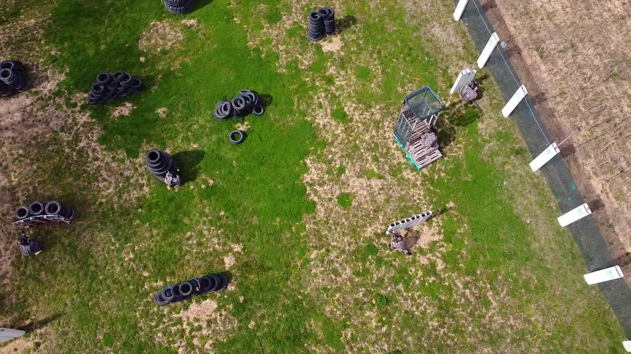 Paintball match between friends drone shot