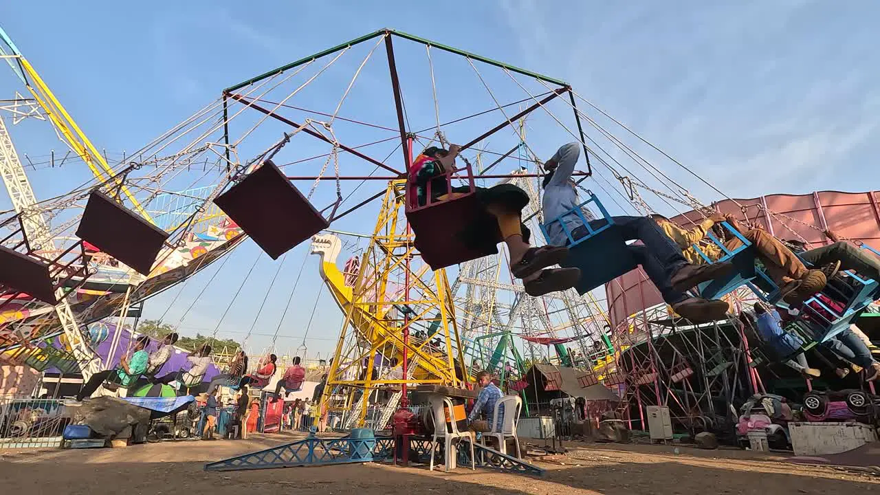 Young boys and girls are having fun enjoying a holiday ride in the park