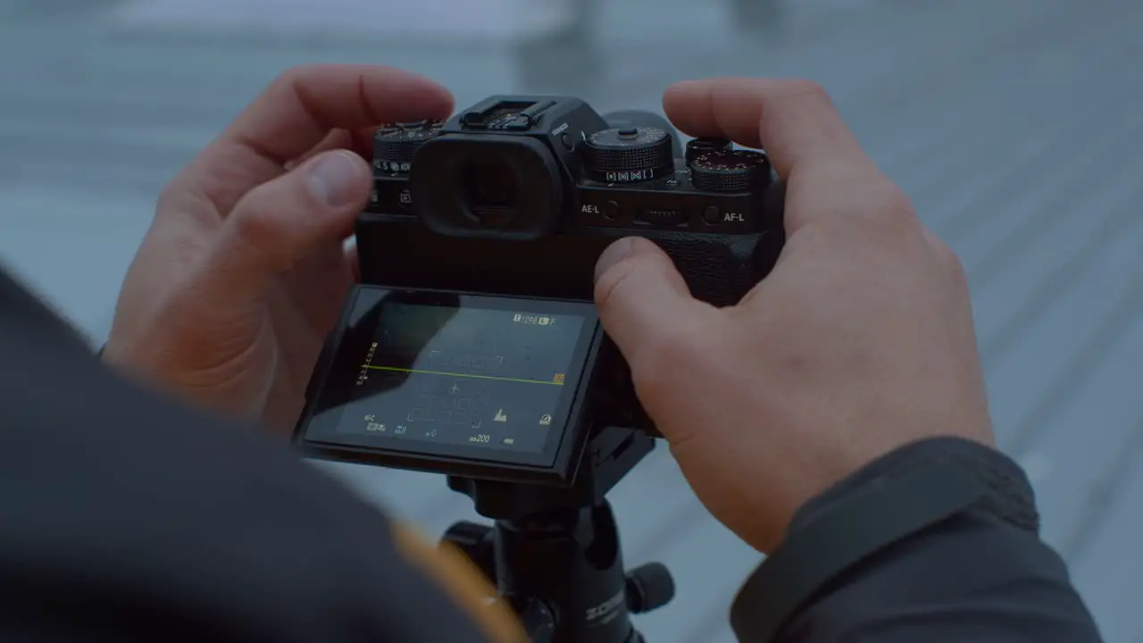 Photographer preparing to take a photo with a camera