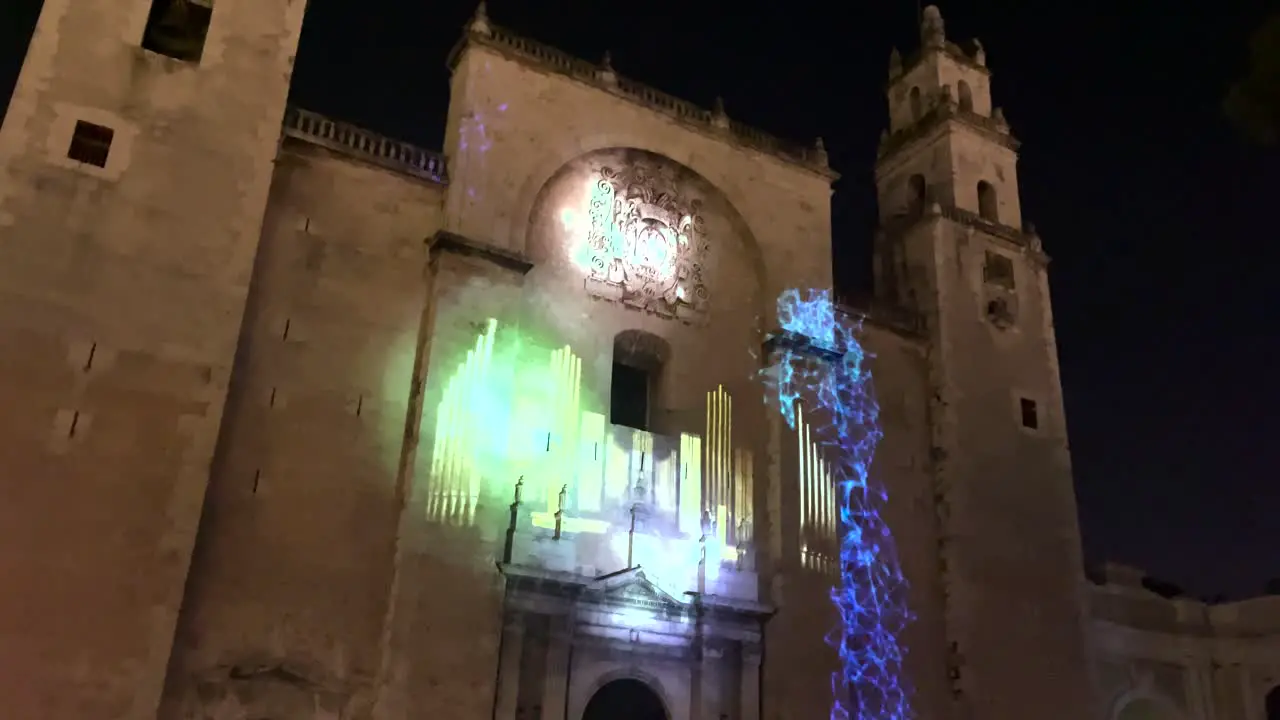 videomapping show showing a harp in the cathedral of merida yucatan