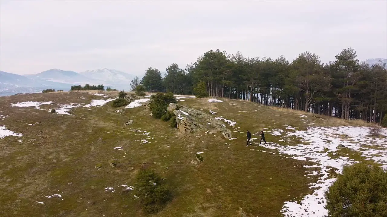 Runners running in nature drone shot