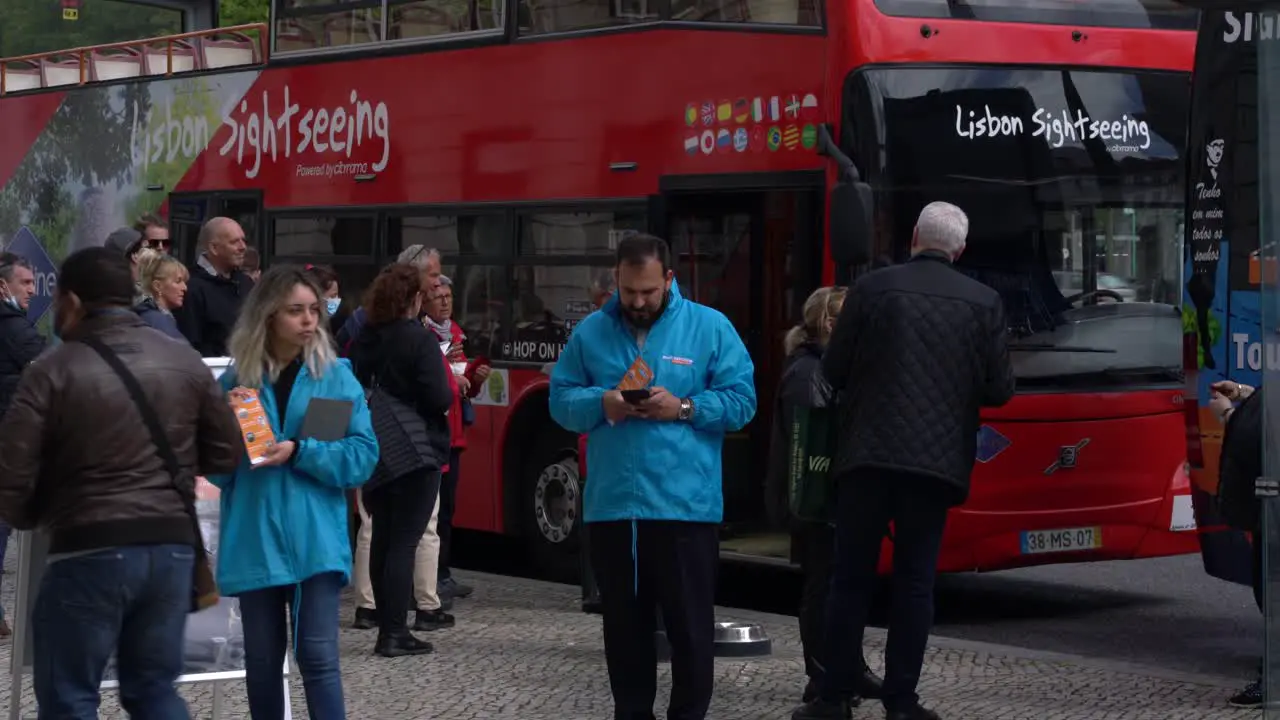 Tourists taking the Lisbon Sightseeing bus tour popular service for people visiting the city