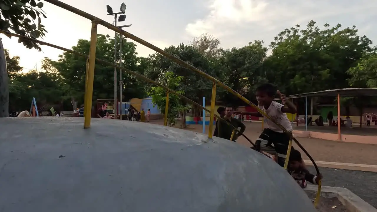 Little children are climbing on amusement park rides on holiday