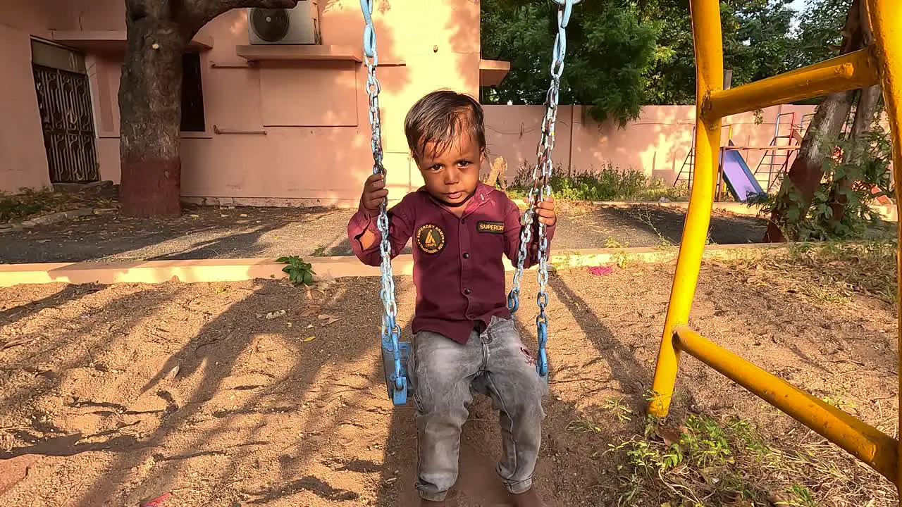 A small child is swinging in a hammock and enjoying a vacation