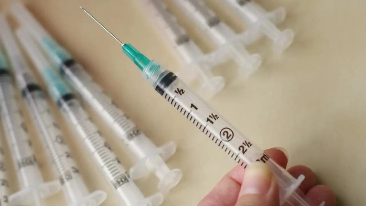 Injection syringe with a precision glide needle