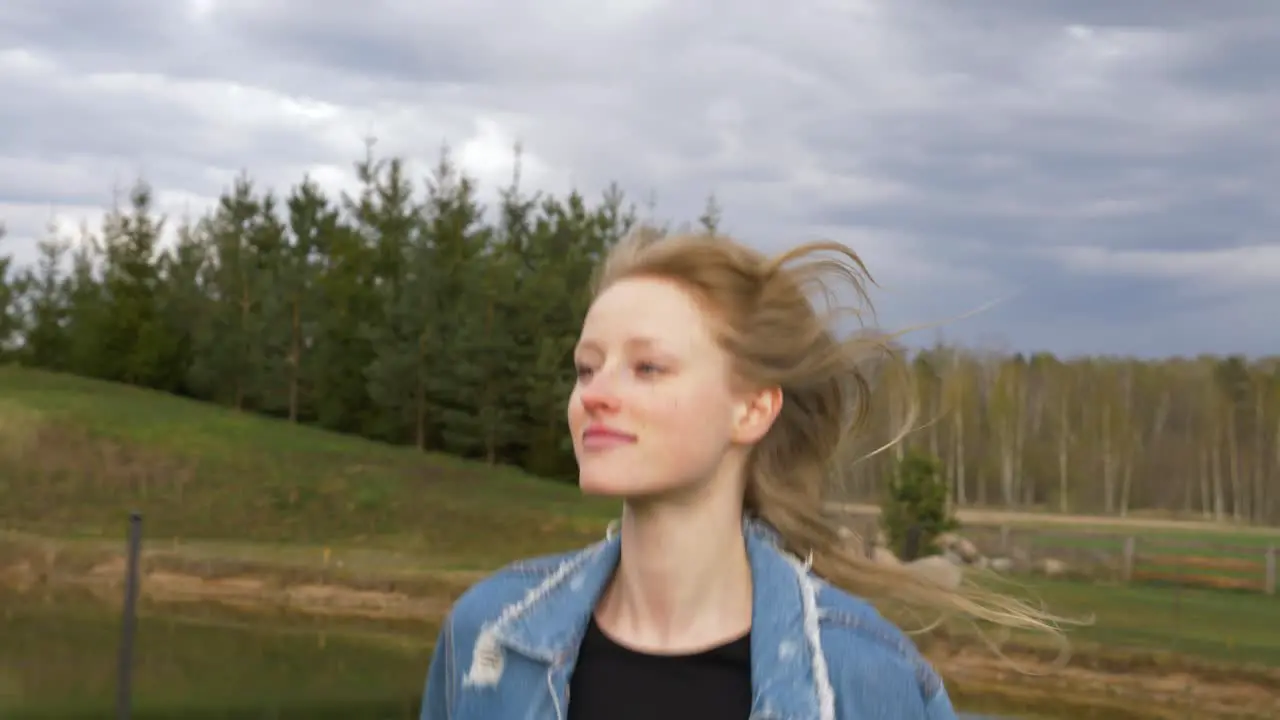 Close up shot of young happy woman running straight