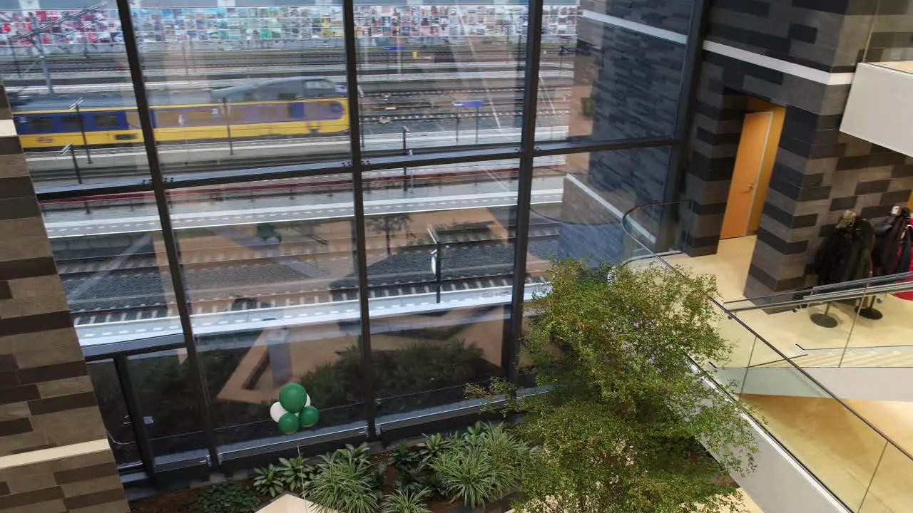 Office Building Of Rabobank Gouda With Modern Interior Of Glass Wall And Fresh Indoor Garden