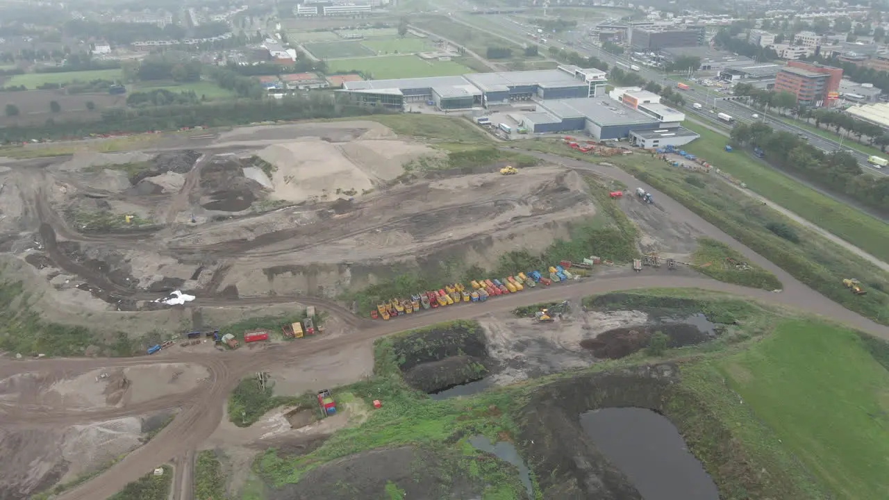 Aerial of sand quarry near industrial area