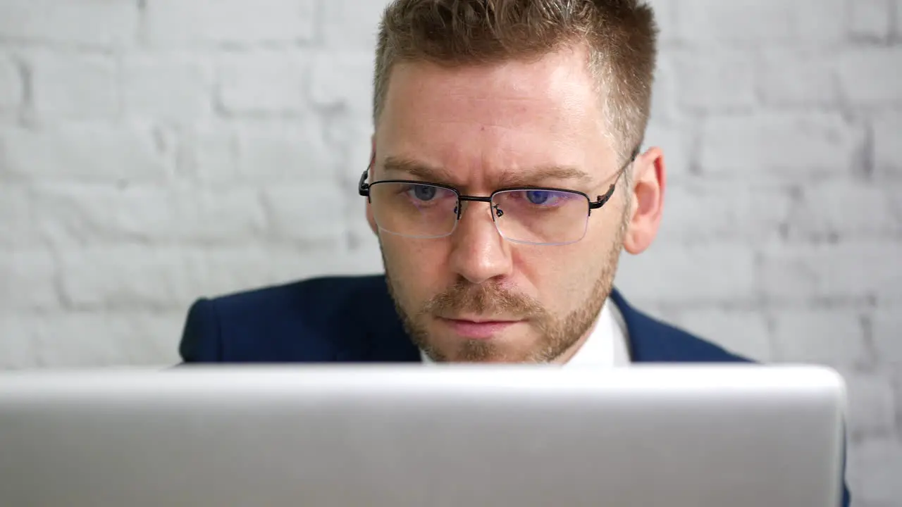 A businessman working on his computer laptop in