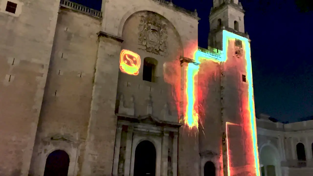 shot of video mapping show with mayan symbols in the cathedral of merida yucatan