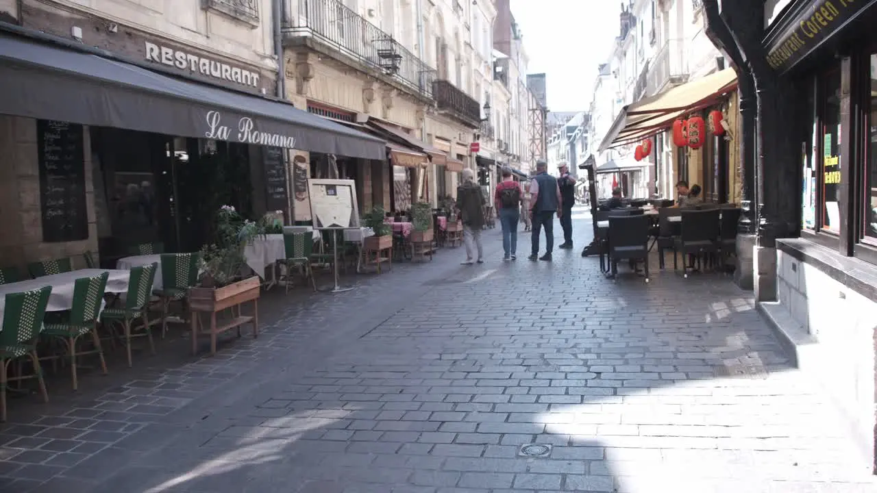 Centre-val de LoireTours old quarter street with pedestrians walking on a sunny day