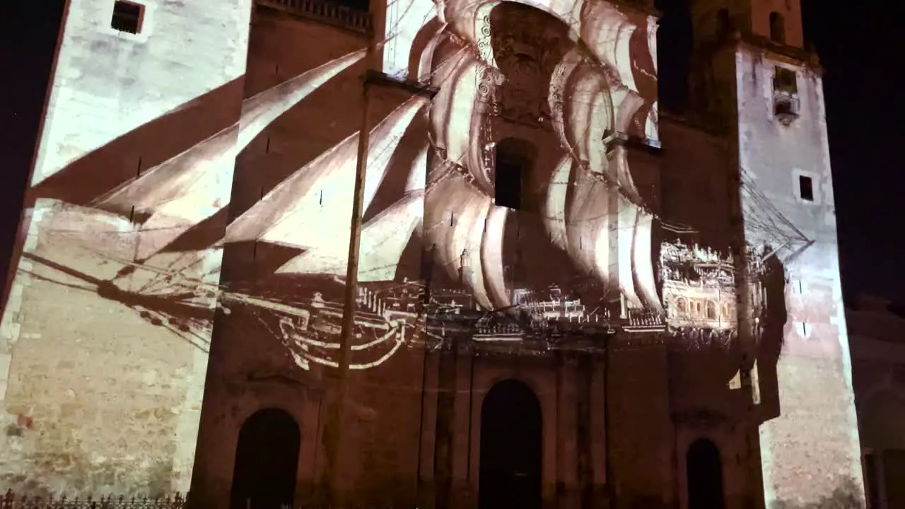 videomapping show showing a pirate ship at the facade of the cathedral of merida yucatan