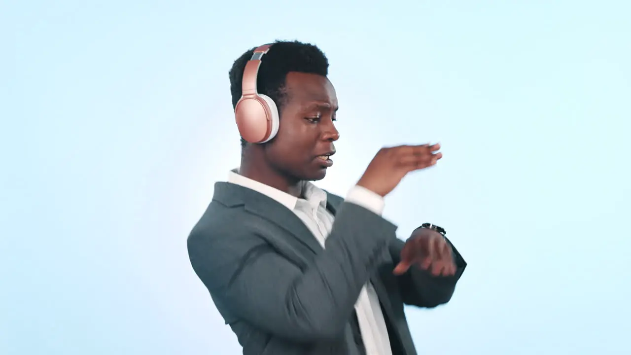 Man dancing and listening to music on headphones