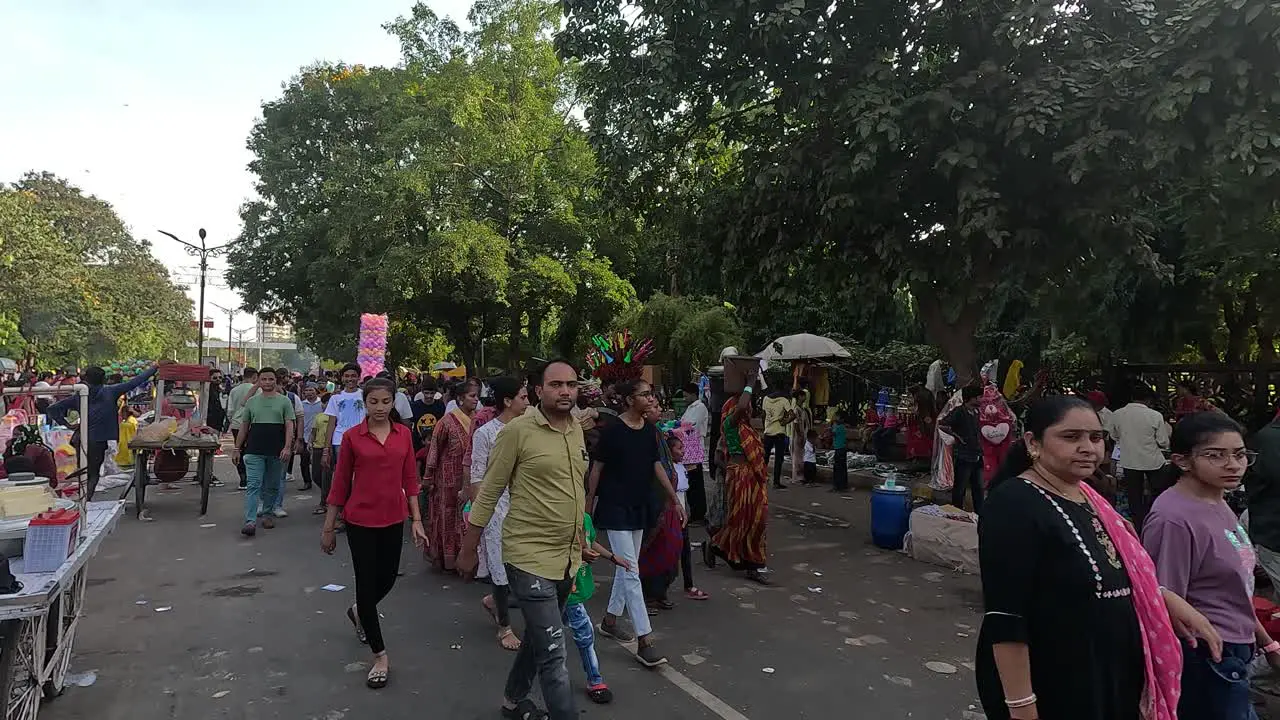 Many people are going inside the fair with their families on holidays