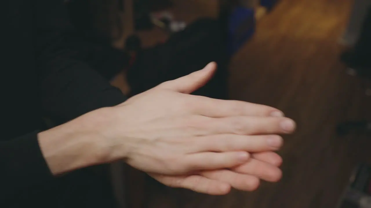 Man Spraying Antibacterial Sanitizer On Hands