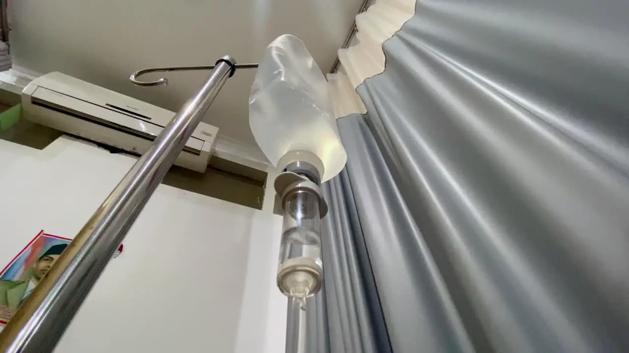 Intravenous drip hose on the ward room with curtain