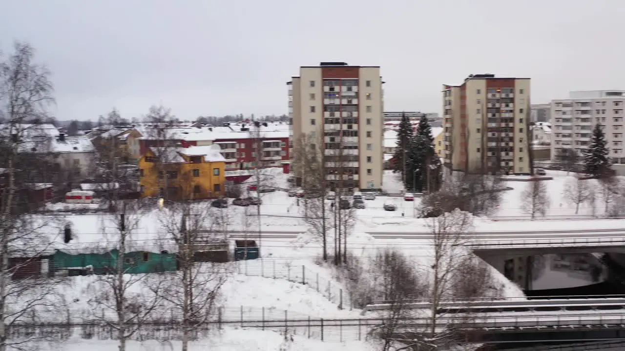 Aerial view of ambulance with sirens driving thru town with sirens