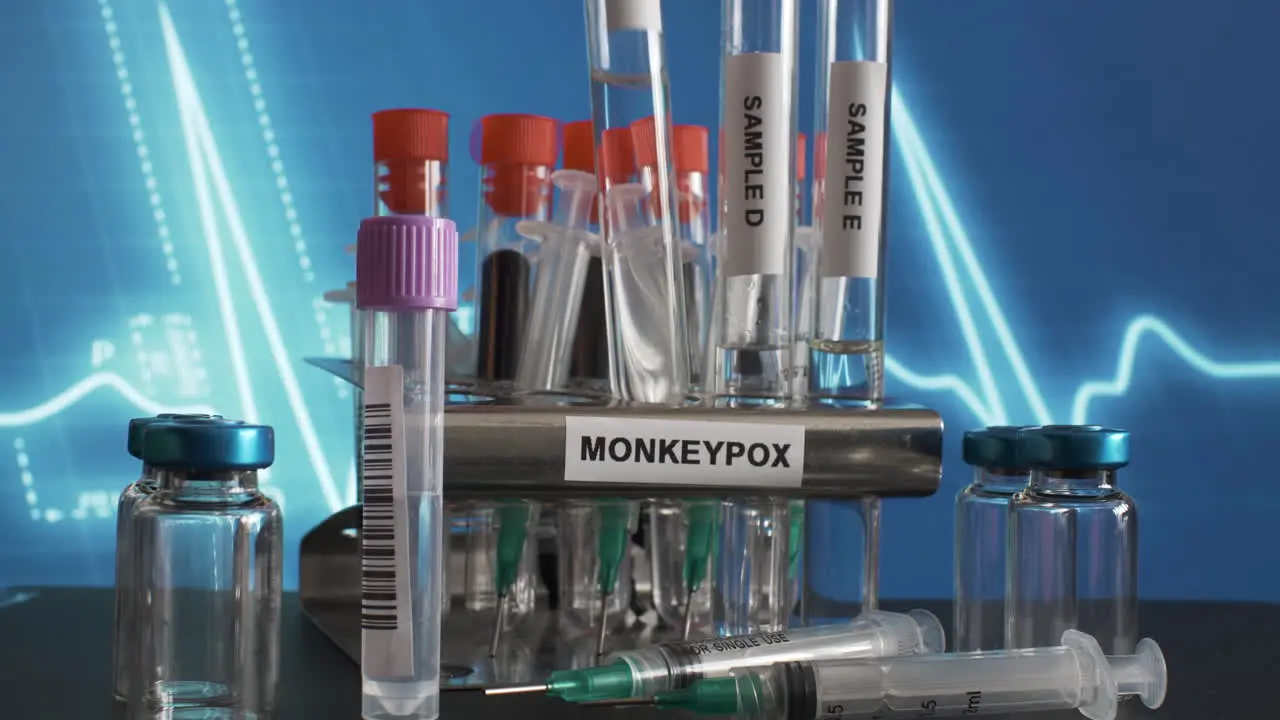 A frontal look on a metal tube rack labelled 'monkeypox