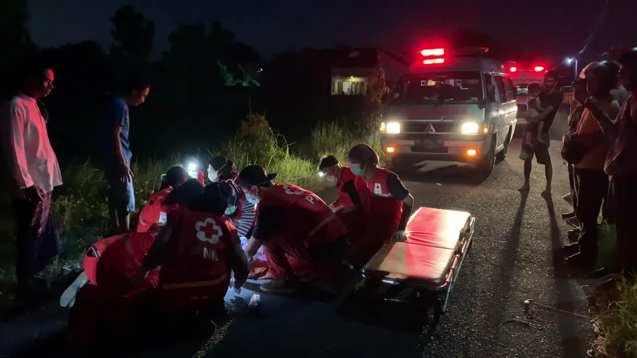 Indonesia Jun 30 2023  Indonesia Red Cross or Palang Merah Indonesia Officers are evacuating the victims of the accident on the road