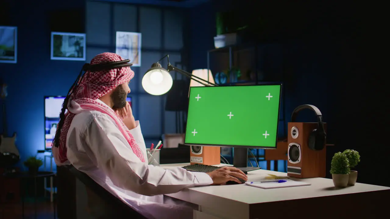 Man looking at mockup computer screen