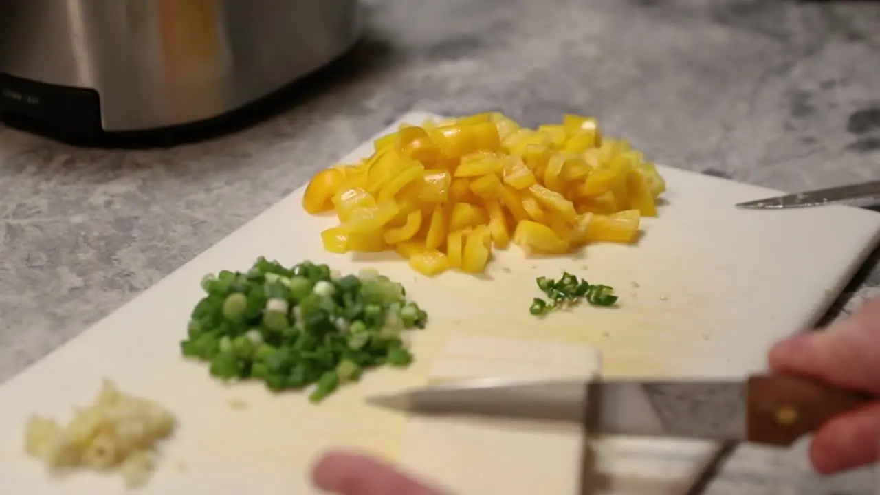 Woman Cutting Paneer On Cutting Board In Slow Motion