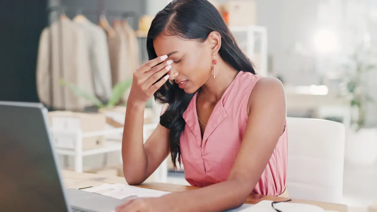 Laptop fashion designer and woman with headache