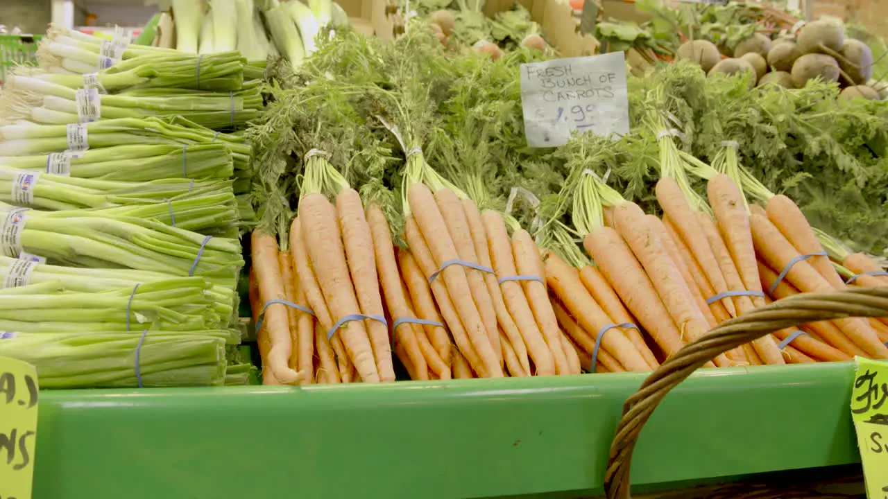 Carrots and green onions for sale at a local farmer's market