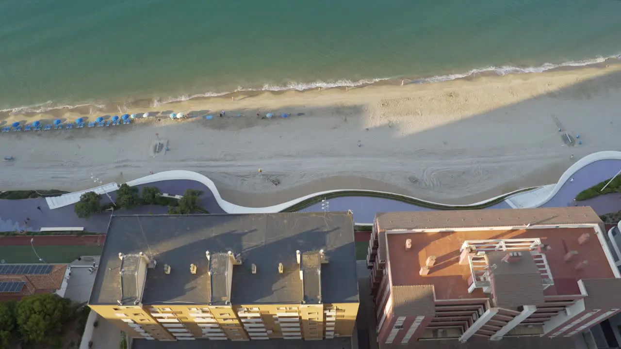 Mediterranean morning Benidorm beach and buildings from above 4K