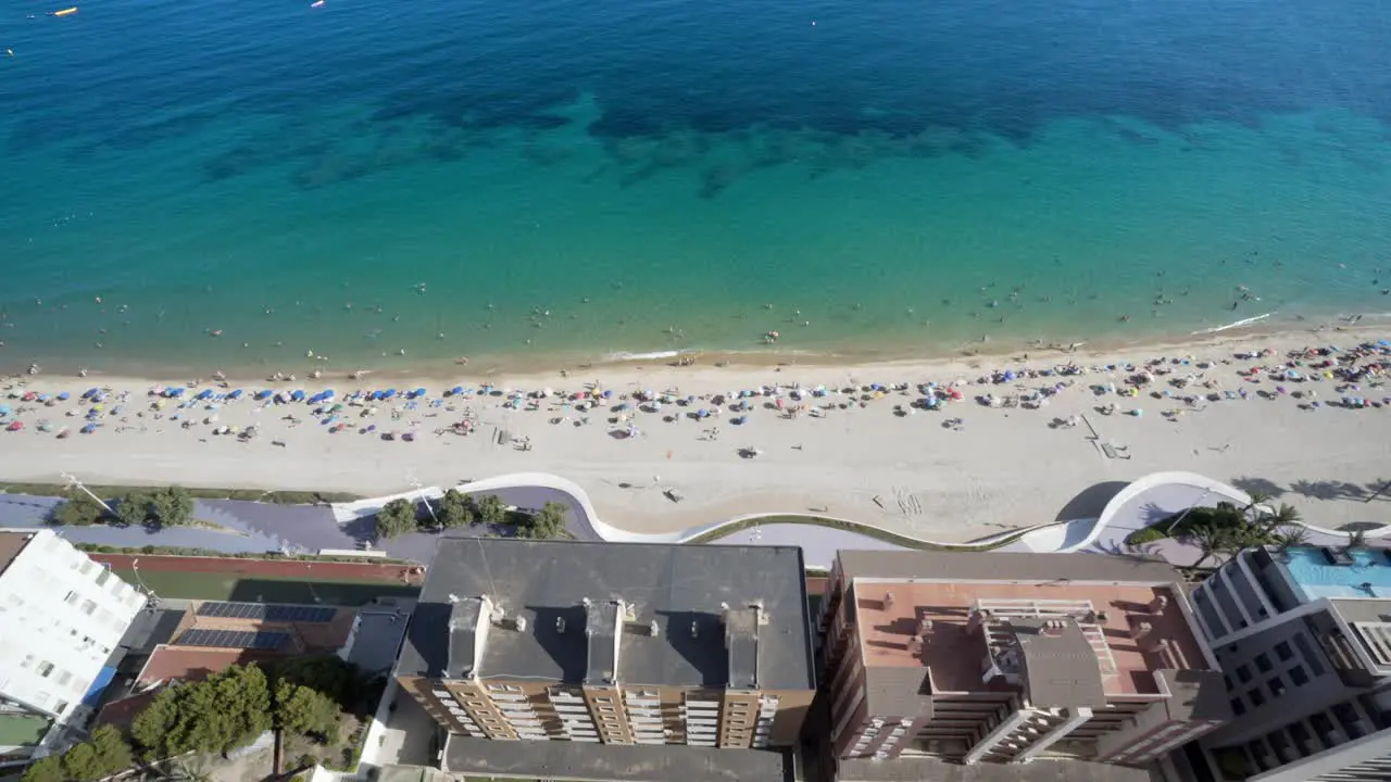 High angle view of Mediterranean beach and buildings Benidorm morning 4K