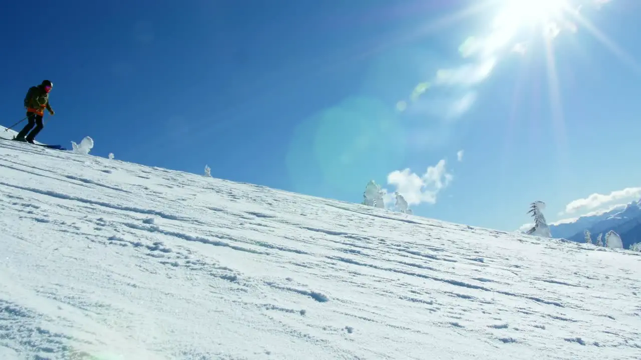 Person snowboarding on snowy mountain