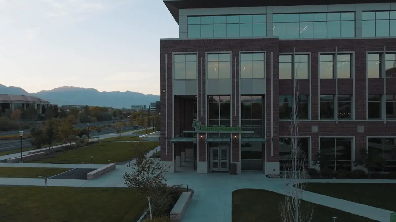 FamilySearch building entrance and logo in Lehi Utah pullback aerial reveal