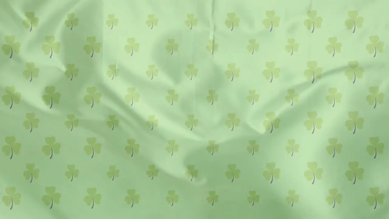 Animation of shamrocks over green background