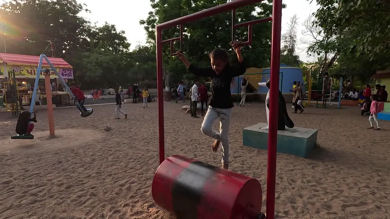 A little girl is running fast on an exercise machine