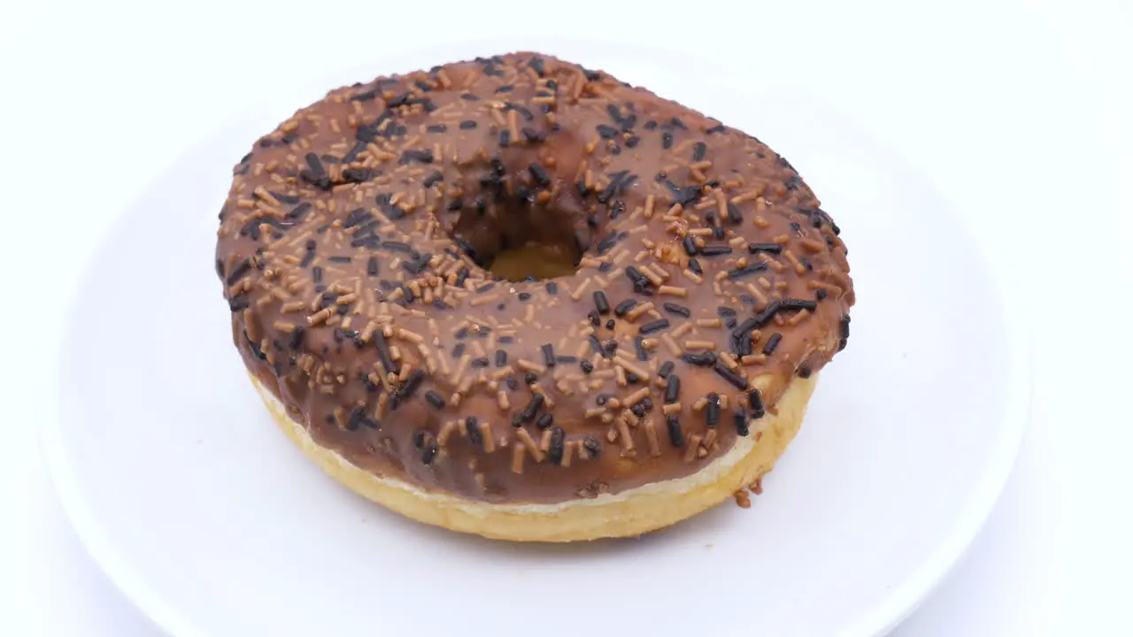 Close Up Rotating Iced Ring Donut