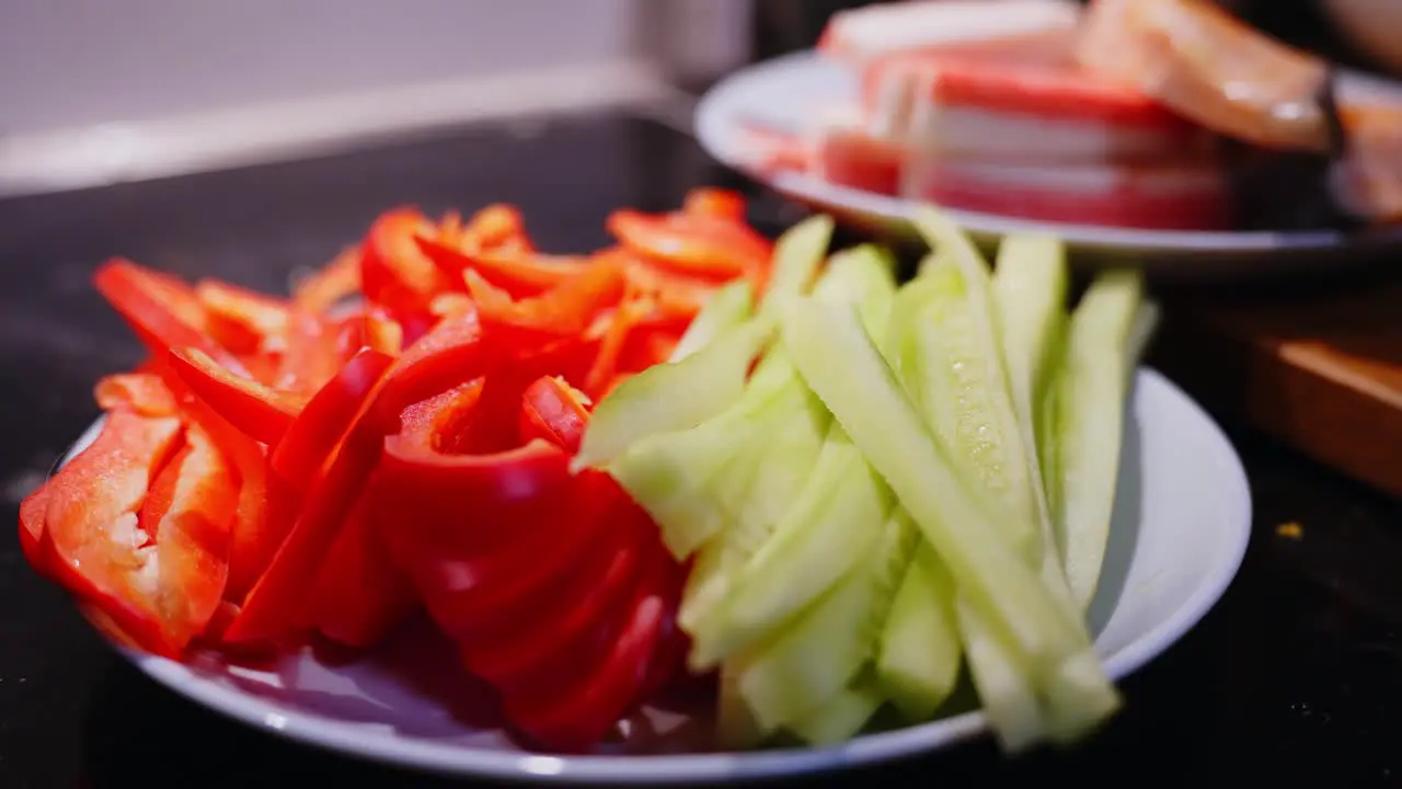 Zooming Out From Tomato And Cucumber Slices Plate Ready For Sushi Preparation