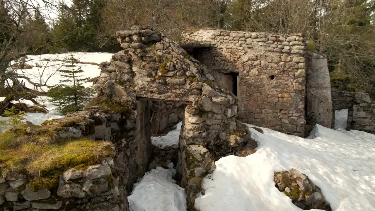 Global view of the entrance of an old WWI bunker covered in snow in France