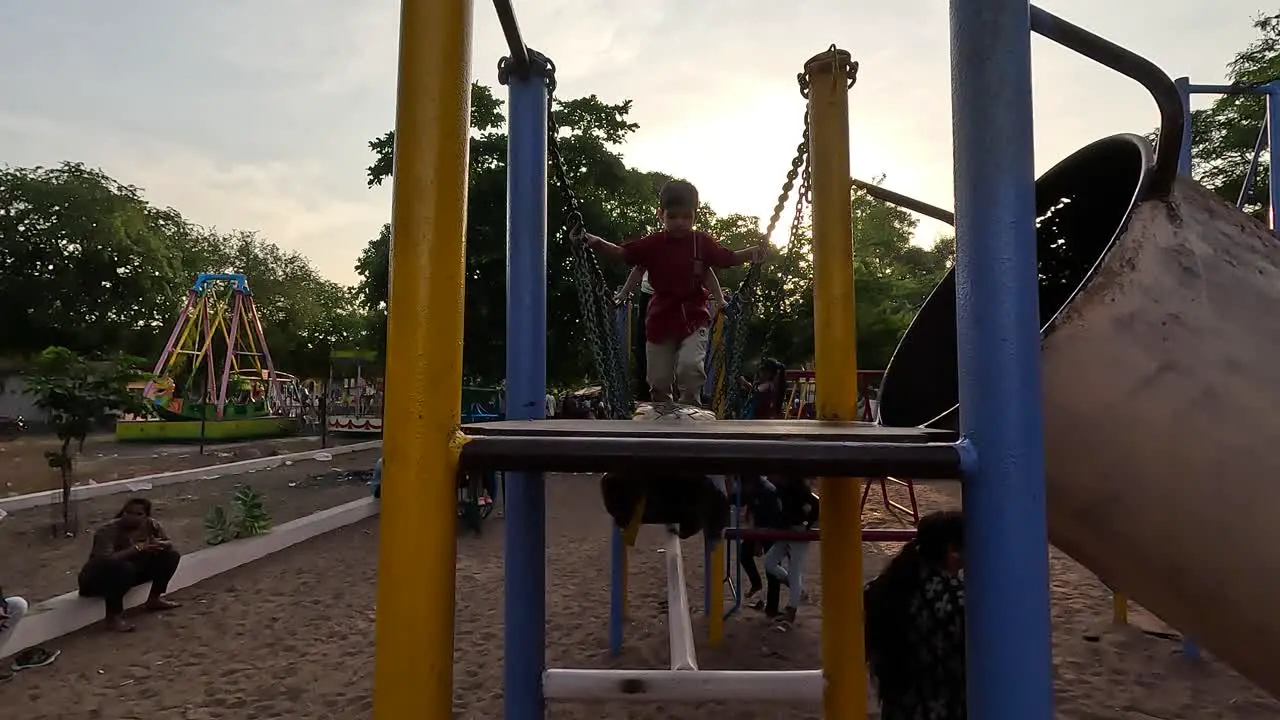 Young children are walking on the suspension bridge and doing their physical strength exercise