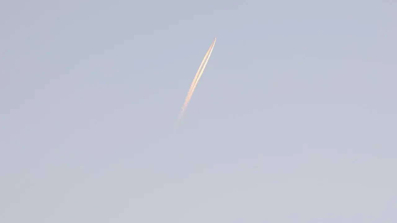 Shot Of Military Fighter Trail Under Blue Sky