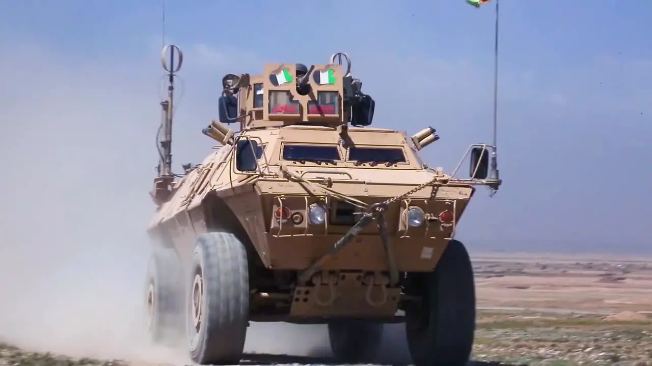 Commando Armored Vehicles Move Across The Landscape In Afghanistan