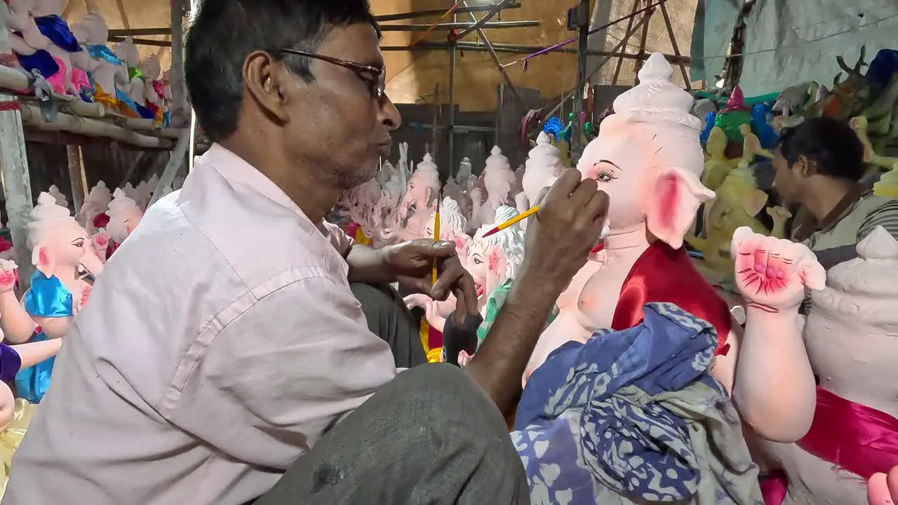 Sculptor making a wonderful idol of Lord Ganesha Happy Ganesh Chaturthi