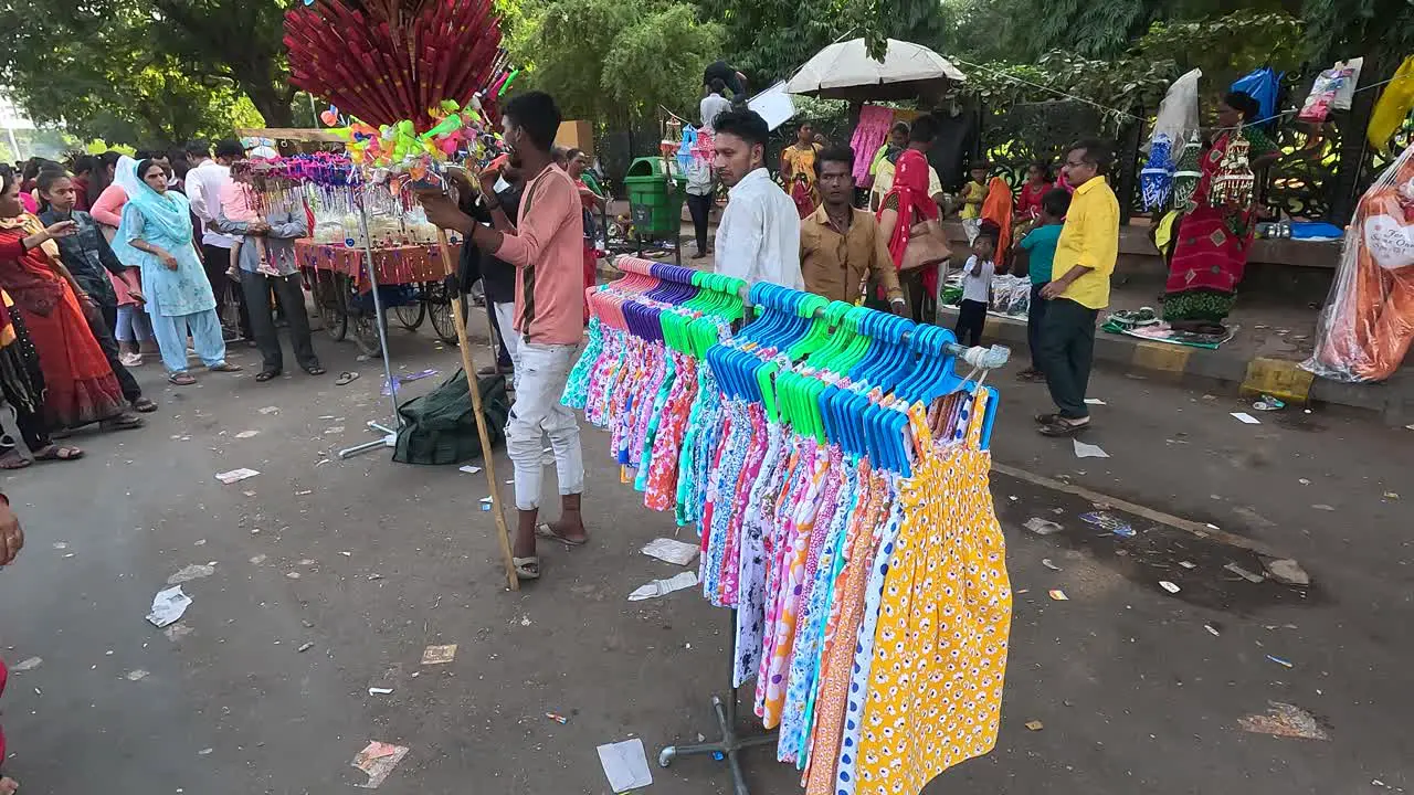 WIDE ANGLE Shoot a shopkeeper selling clothes on the road