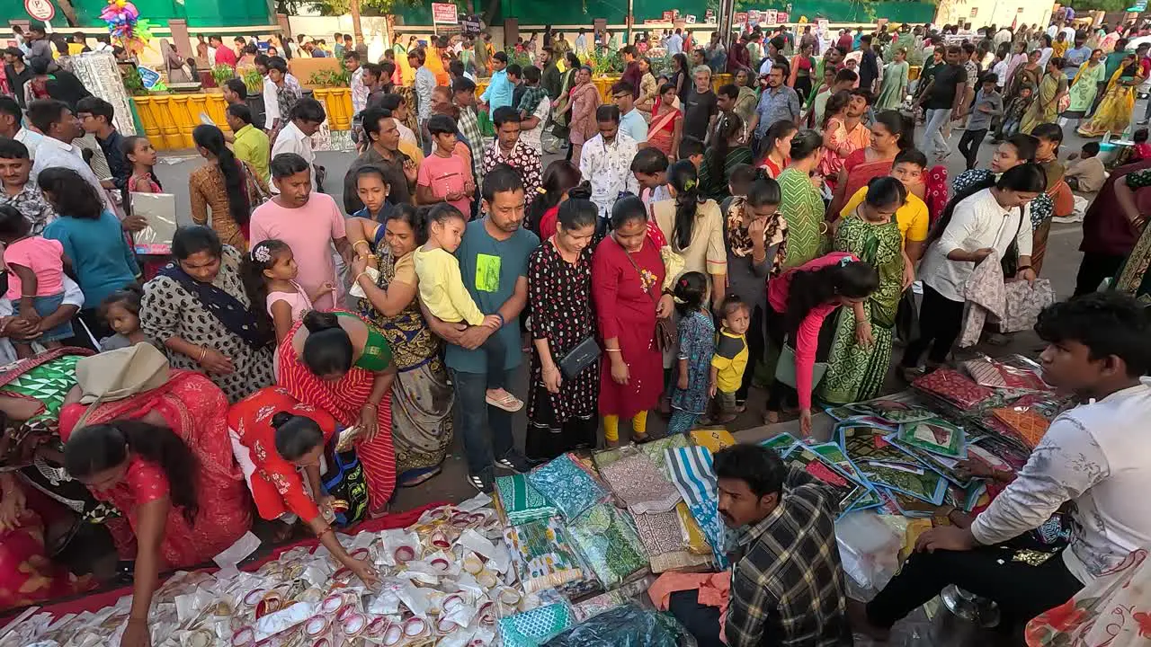 Many women are shopping in the fair with their families